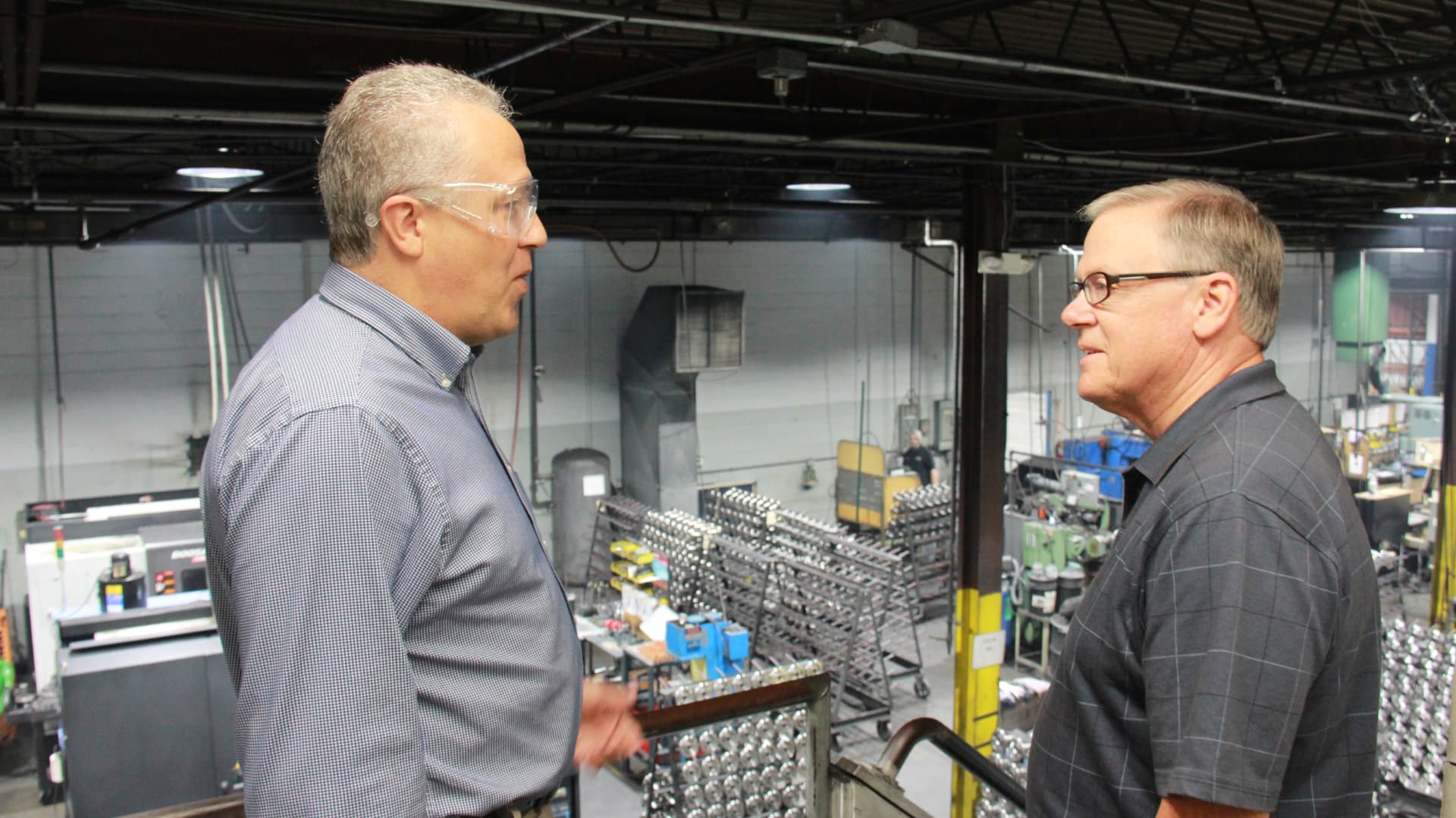 Mike Gaskill touring an Indiana manufacturing floor with a local employer